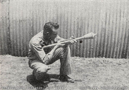 [A U. S. soldier demonstrates the Panzerfaust klein 30.]